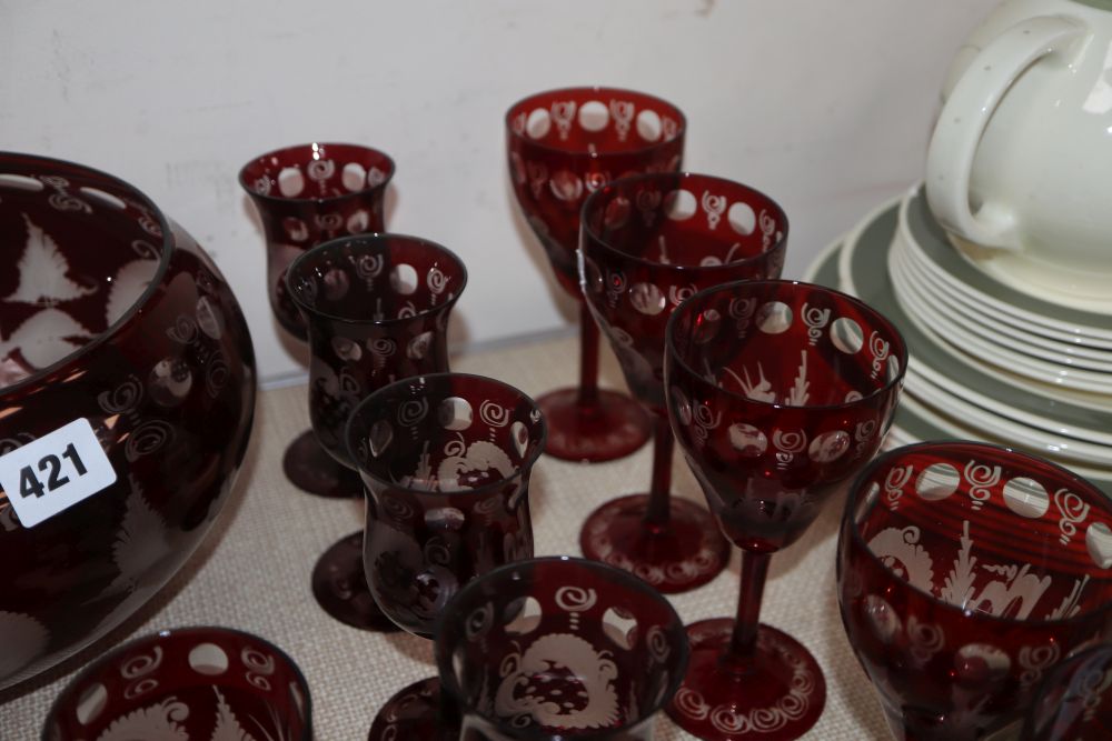 A quantity of cranberry glassware